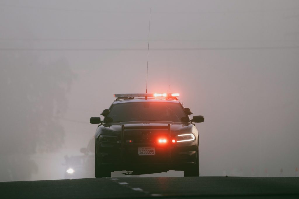 Police vehicle with emergency lights during a DUI traffic stop in Colorado Springs.