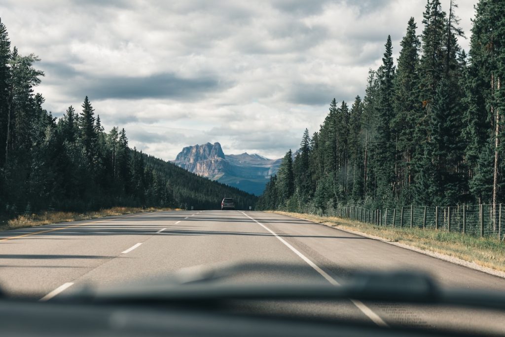 Vehicle traveling on a mountain highway in Colorado.